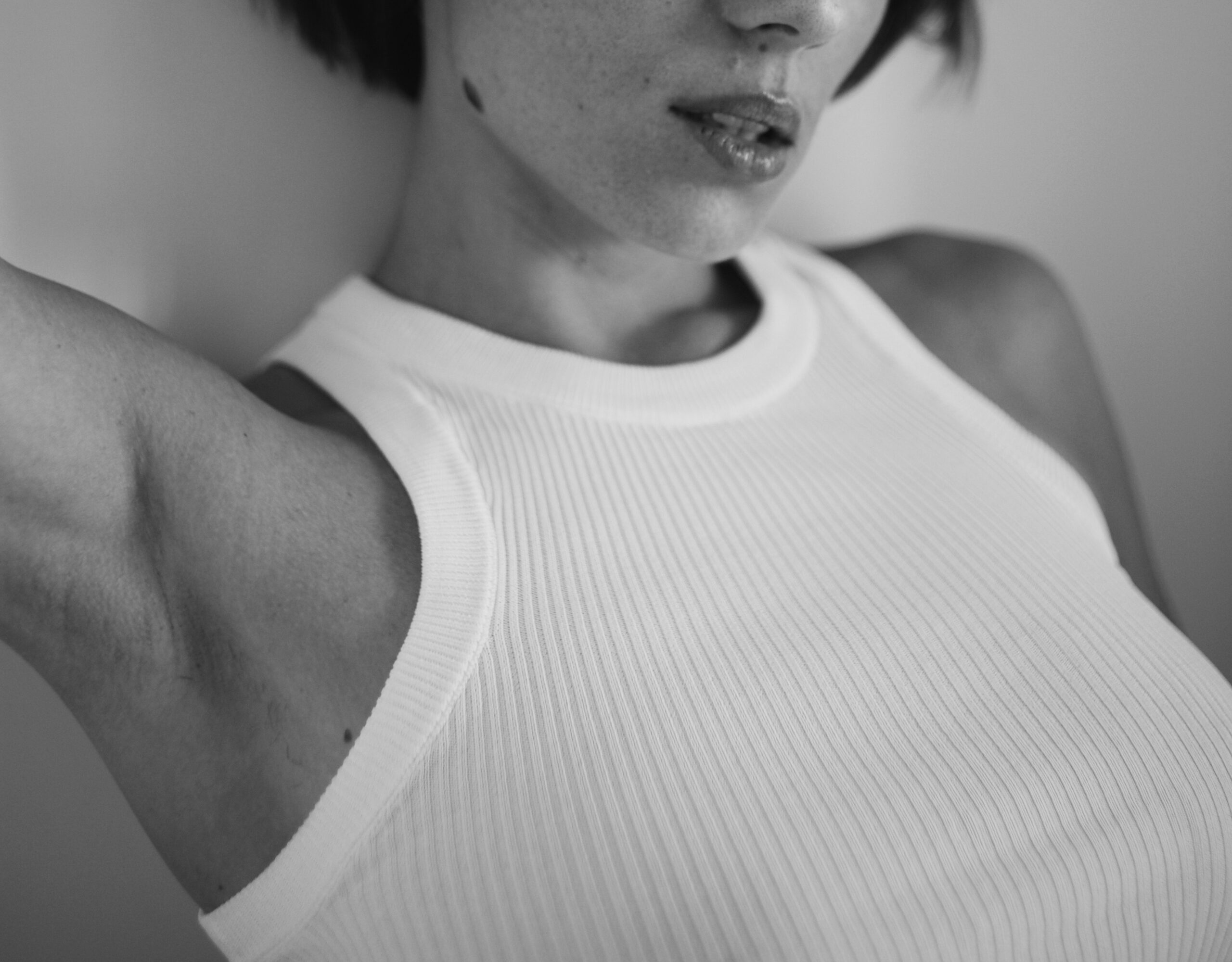 Black and white photo of a woman in a vest top. Branding Mistakes To Avoid